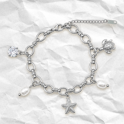 CORAL - Bracelet à BRELOQUES avec coquillages, éléments océan BYNOVANN